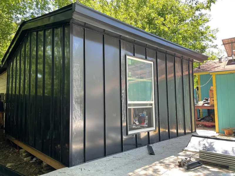 Black standing seam metal wall panels for Metal Roof Installation in Sterling